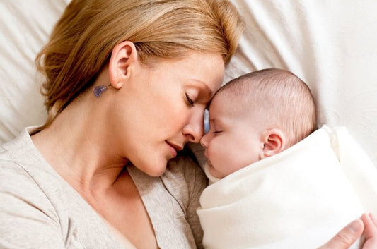 mother holding toddler